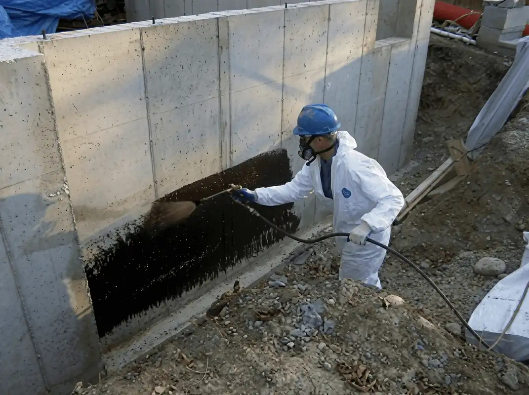 Professional waterproofing the exterior walls of the basement in Baltimore, MD