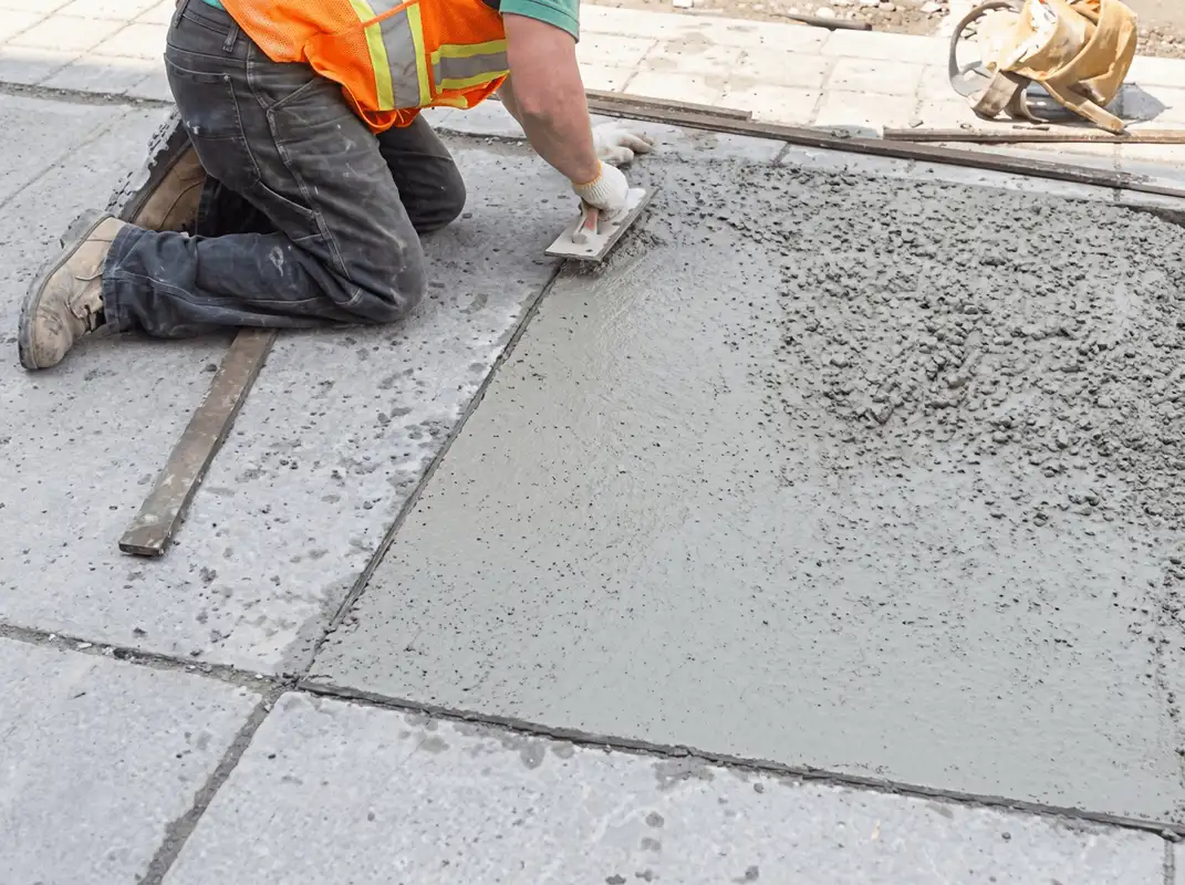 Professional repairing a concrete floor in Baltimore, MD