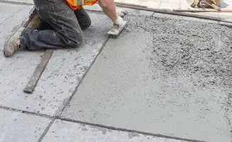 Professional repairing a concrete floor in Baltimore, MD
